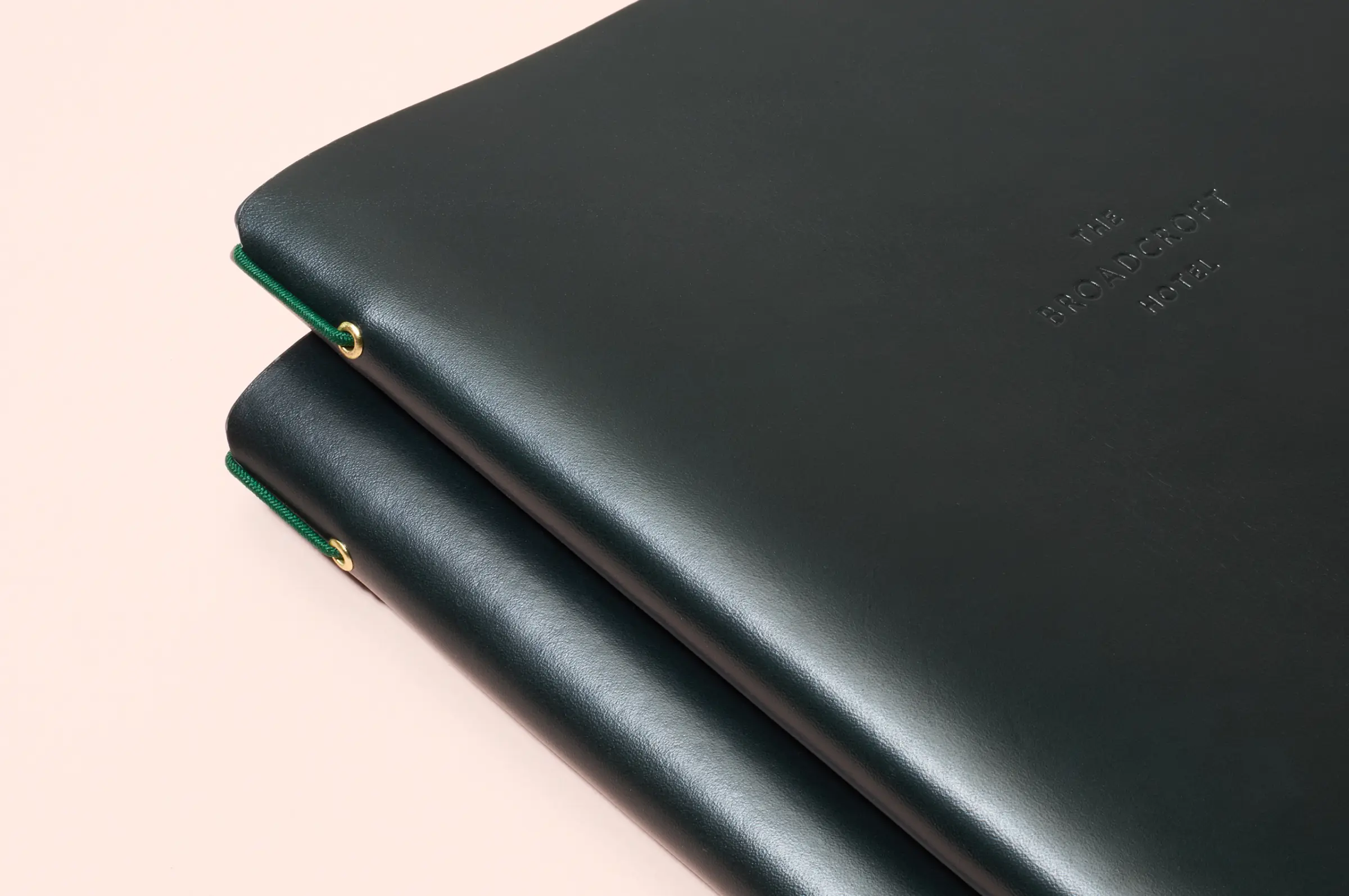 Leather menus for London restaurant on Mount Street, bespoke binding device to aid daily menu updates